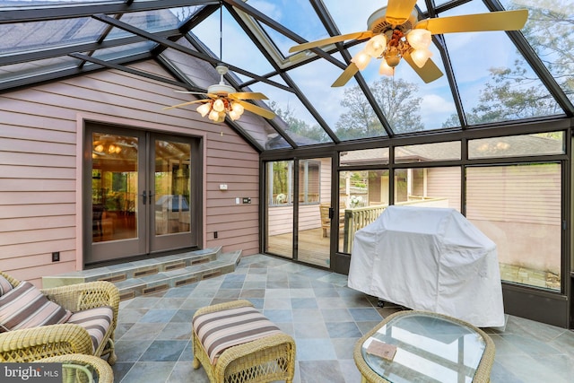 sunroom featuring ceiling fan, a wealth of natural light, and french doors