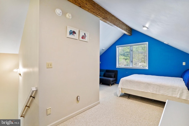 carpeted bedroom with vaulted ceiling with beams and baseboards