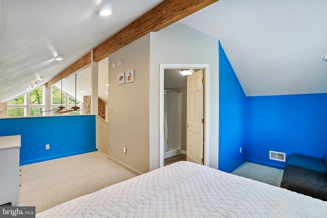 carpeted bedroom featuring lofted ceiling with beams, visible vents, baseboards, and a spacious closet