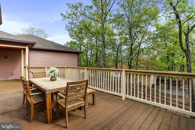wooden deck with outdoor dining area