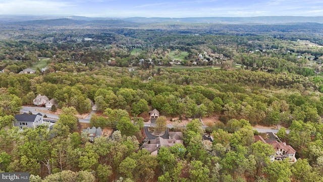 aerial view featuring a wooded view