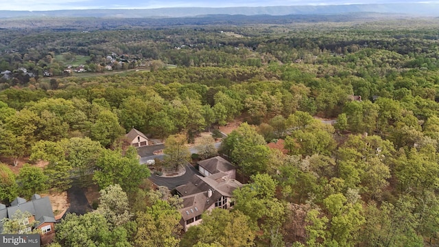 birds eye view of property with a wooded view