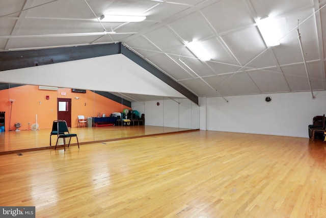 interior space with lofted ceiling and wood finished floors