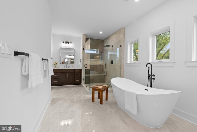 3418 Arnold Ln, Falls Church, VA 22042 - bathroom featuring a soaking tub, vanity, marble finish floor, a stall shower, and baseboards