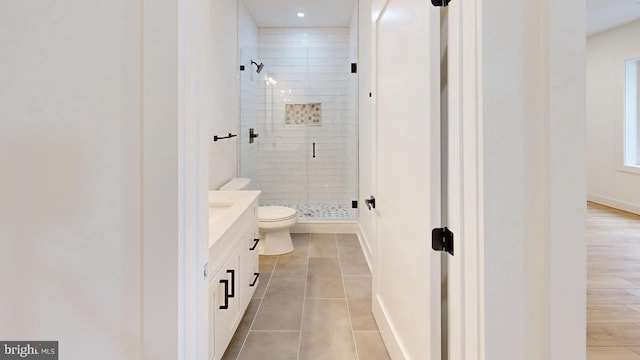 3418 Arnold Ln, Falls Church, VA 22042 - full bath with vanity, baseboards, a stall shower, tile patterned floors, and toilet