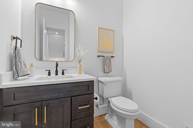 3418 Arnold Ln, Falls Church, VA 22042 - half bath with toilet, wood finished floors, vanity, and baseboards
