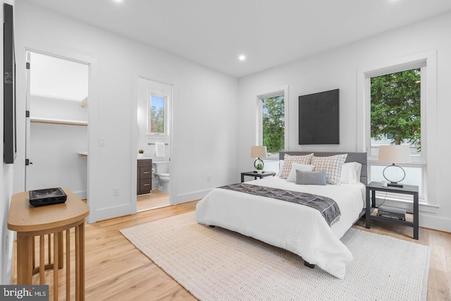 3418 Arnold Ln, Falls Church, VA 22042 - bedroom featuring light wood-style floors, multiple windows, a spacious closet, and recessed lighting