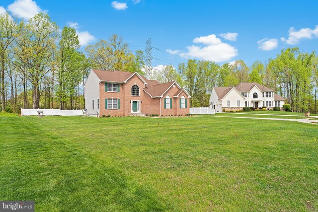311 Patsy Ct, West Deptford, NJ 08066 - view of front of home with brick siding, crawl space, a front lawn, and fence