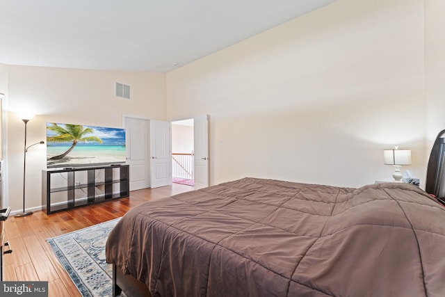 311 Patsy Ct, West Deptford, NJ 08066 - bedroom featuring high vaulted ceiling, wood finished floors, and visible vents