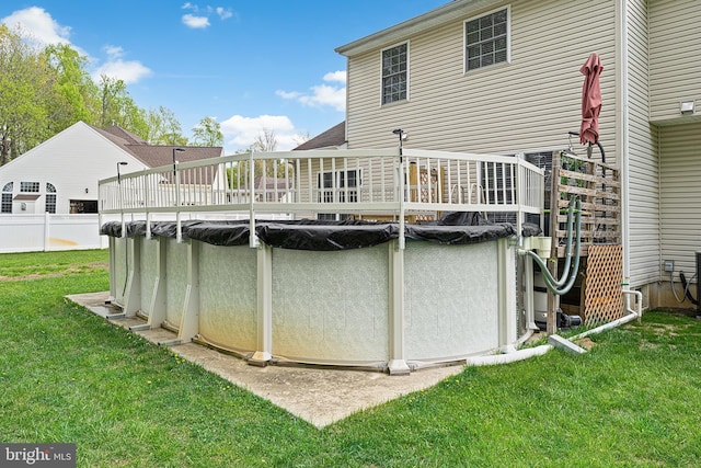 311 Patsy Ct, West Deptford, NJ 08066 - rear view of house with a covered pool, a yard, and a deck