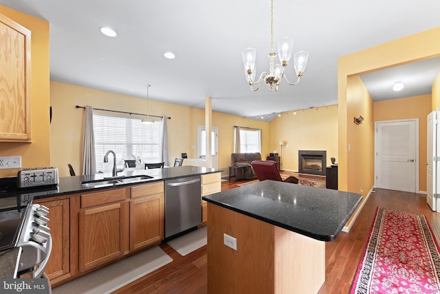 311 Patsy Ct, West Deptford, NJ 08066 - kitchen with dark wood-style flooring, a sink, appliances with stainless steel finishes, a fireplace, and a notable chandelier