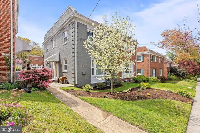 1448 Sheridan St NW, Washington, DC 20011 - view of side of property featuring brick siding and a yard