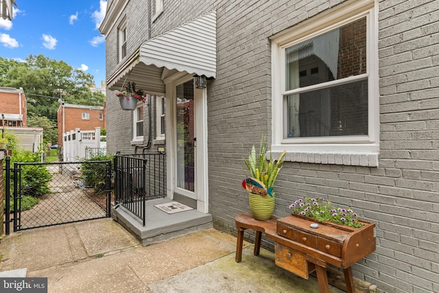1448 Sheridan St NW, Washington, DC 20011 - doorway to property with a gate and brick siding