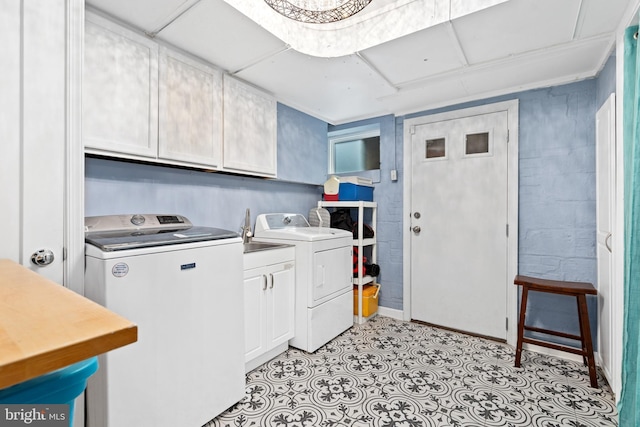 1448 Sheridan St NW, Washington, DC 20011 - laundry area featuring cabinet space, washer and dryer, and light floors