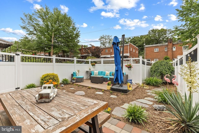1448 Sheridan St NW, Washington, DC 20011 - fenced backyard with outdoor lounge area and a wooden deck