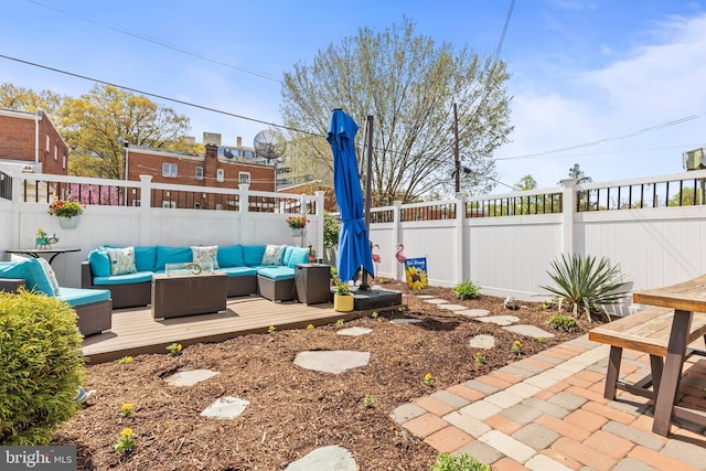 1448 Sheridan St NW, Washington, DC 20011 - fenced backyard with outdoor lounge area, a deck, and a patio