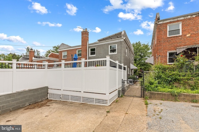 1448 Sheridan St NW, Washington, DC 20011 - back of house featuring a gate and a patio area
