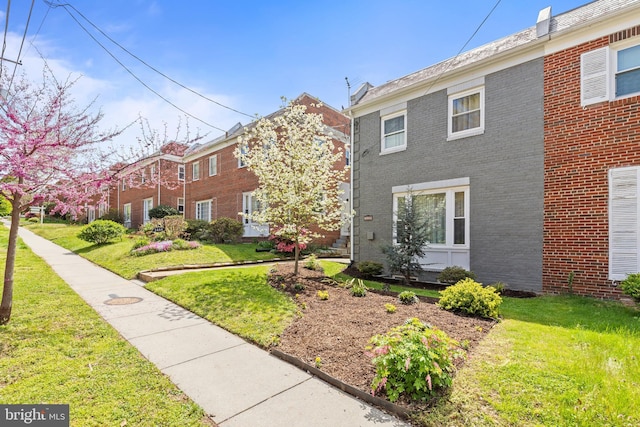 1448 Sheridan St NW, Washington, DC 20011 - view of front of home featuring brick siding and a front yard