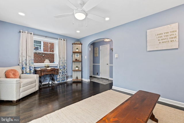 1448 Sheridan St NW, Washington, DC 20011 - living area featuring arched walkways, ceiling fan, wood finished floors, baseboards, and recessed lighting