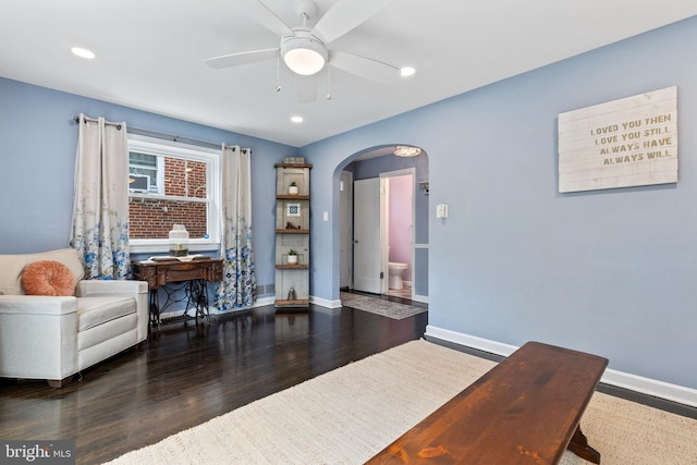 1448 Sheridan St NW, Washington, DC 20011 - living area featuring arched walkways, a ceiling fan, baseboards, wood finished floors, and recessed lighting