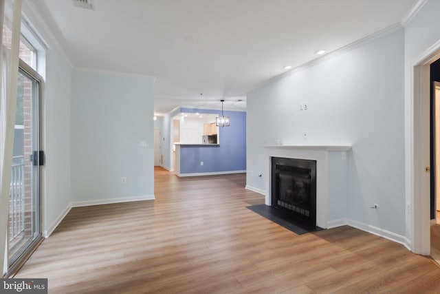 unfurnished living room with recessed lighting, crown molding, light wood-style flooring, baseboards, and a fireplace with flush hearth