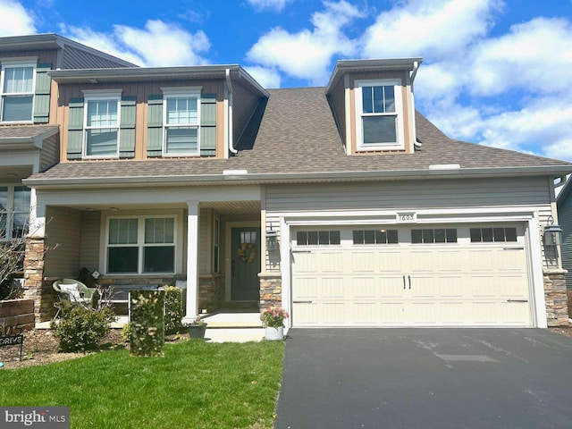 1605 Quincey Dr, Mechanicsburg, PA 17050 - view of front of property featuring a shingled roof, stone siding, a garage, and driveway