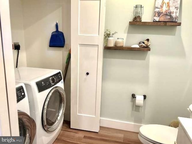 1605 Quincey Dr, Mechanicsburg, PA 17050 - laundry area with separate washer and dryer, baseboards, laundry area, and wood finished floors