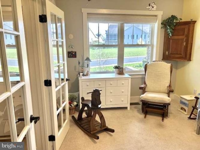 1605 Quincey Dr, Mechanicsburg, PA 17050 - living area with french doors, a wealth of natural light, and light carpet