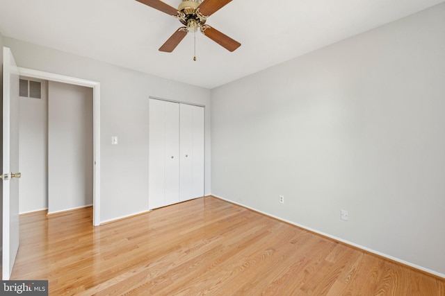 809 Floral Pl NW, Washington, DC 20012 - unfurnished bedroom featuring light wood finished floors, a closet, and ceiling fan