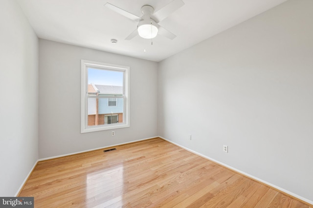 809 Floral Pl NW, Washington, DC 20012 - unfurnished room with wood finished floors, ceiling fan, and a smoke detector