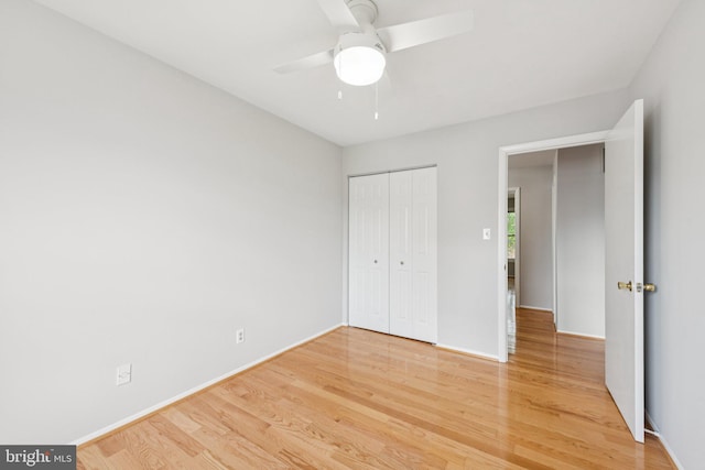 809 Floral Pl NW, Washington, DC 20012 - unfurnished bedroom with wood finished floors, a closet, and a ceiling fan