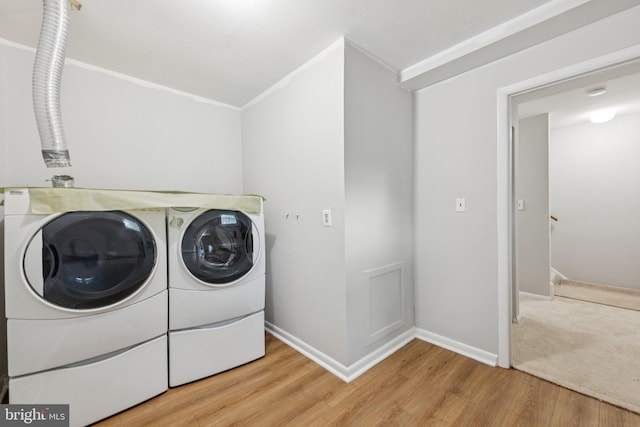 809 Floral Pl NW, Washington, DC 20012 - laundry room featuring washer and dryer and wood finished floors