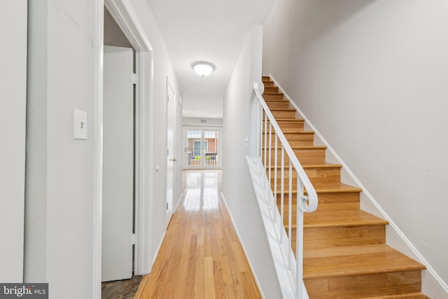 809 Floral Pl NW, Washington, DC 20012 - stairway featuring wood finished floors and baseboards