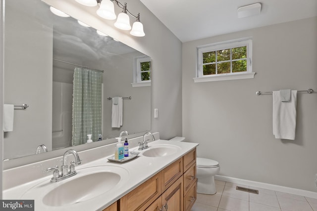 41 Hillview Rd, Morgantown, PA 19543 - full bath featuring toilet, double vanity, tile patterned flooring, a shower with shower curtain, and baseboards