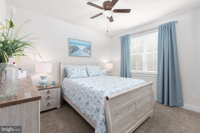 carpeted bedroom with baseboards and ceiling fan