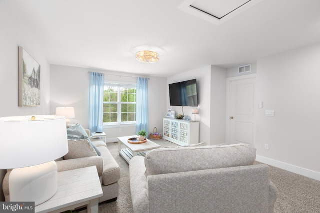 carpeted living room with baseboards and visible vents