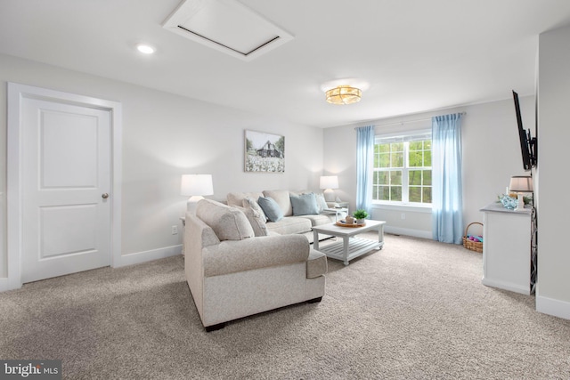 living area featuring attic access, baseboards, recessed lighting, and light colored carpet