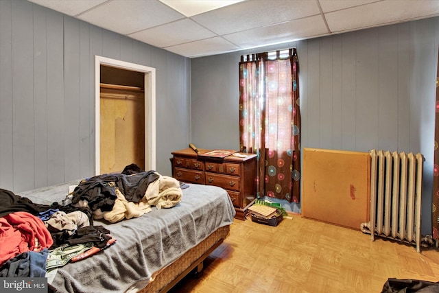 417 N Nichols St, Pottsville, PA 17901 - bedroom with radiator and wood walls