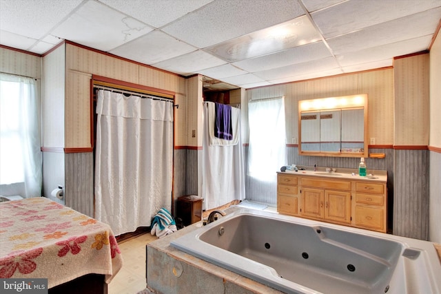 417 N Nichols St, Pottsville, PA 17901 - bathroom featuring a paneled ceiling, wallpapered walls, a wainscoted wall, and a jetted tub