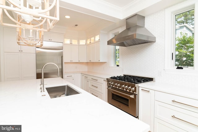 816 Garfield Pkwy, Bethany Beach, DE 19930 - kitchen with island exhaust hood, refrigerator, stainless steel stove, a sink, and a chandelier