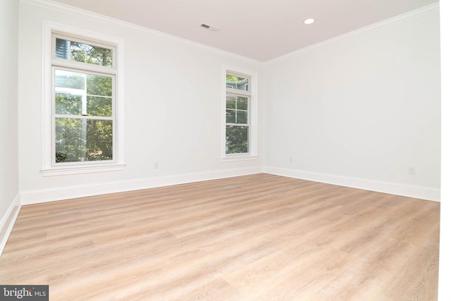 816 Garfield Pkwy, Bethany Beach, DE 19930 - unfurnished room featuring healthy amount of natural light, light wood-style flooring, baseboards, crown molding, and recessed lighting