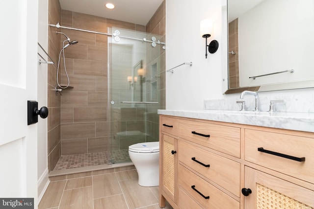 816 Garfield Pkwy, Bethany Beach, DE 19930 - bathroom featuring vanity, toilet, a shower stall, recessed lighting, and tile patterned flooring
