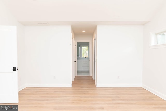 816 Garfield Pkwy, Bethany Beach, DE 19930 - empty room featuring light wood finished floors, baseboards, and plenty of natural light