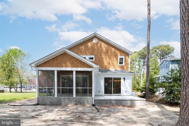 816 Garfield Pkwy, Bethany Beach, DE 19930 - back of property featuring a sunroom and a patio area