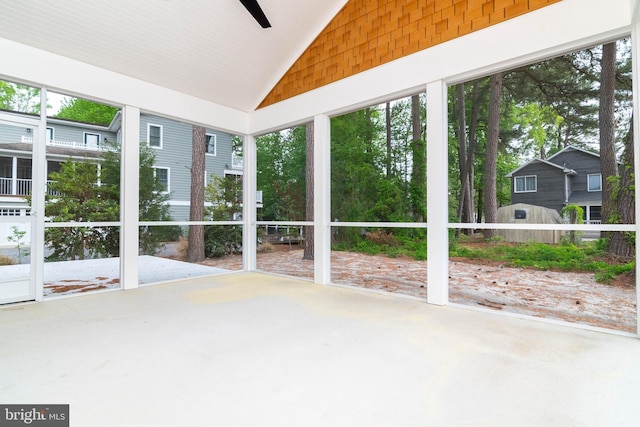 816 Garfield Pkwy, Bethany Beach, DE 19930 - unfurnished sunroom featuring vaulted ceiling, plenty of natural light, and ceiling fan
