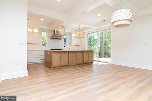 816 Garfield Pkwy, Bethany Beach, DE 19930 - kitchen with a chandelier, decorative backsplash, a sink, baseboards, and beamed ceiling