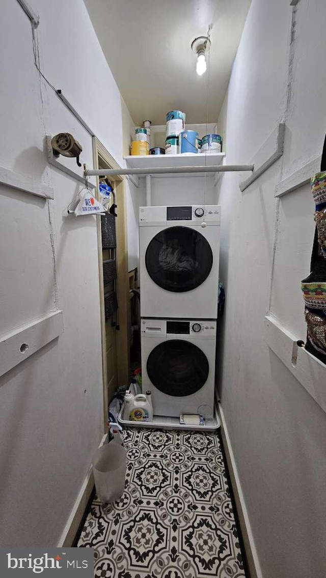 124 W Church St, Frederick, MD 21701 - laundry room featuring stacked washer and dryer, baseboards, and laundry area