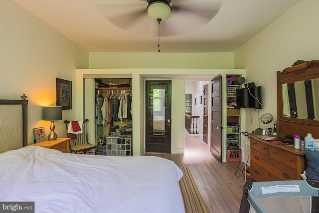 bedroom featuring wood finished floors, a closet, and ceiling fan