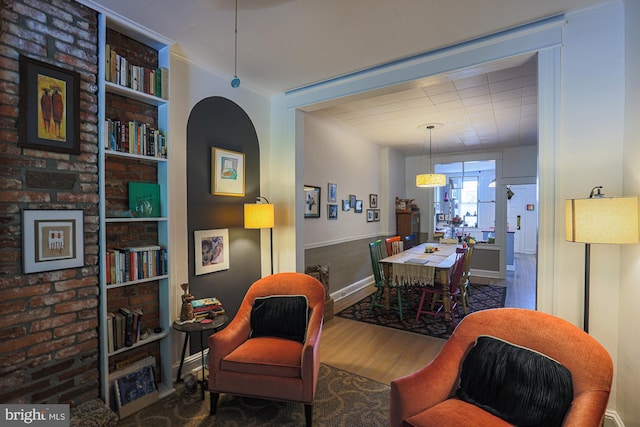 dining room featuring wood finished floors and crown molding