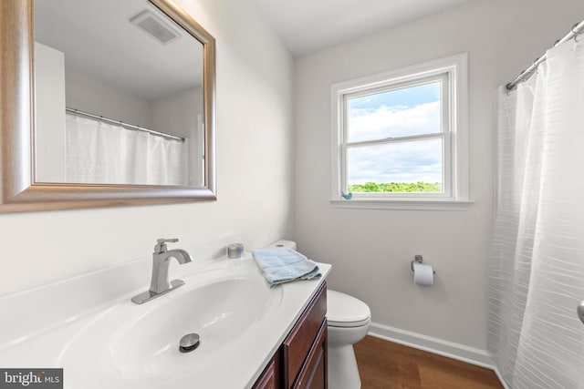 442 Frog Hollow Rd, Winchester, VA 22603 - bathroom featuring vanity, toilet, wood finished floors, and baseboards